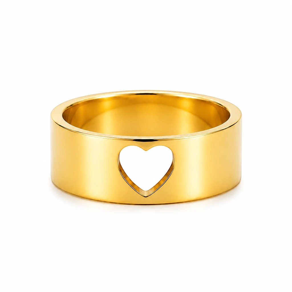JOYAS gold band ring featuring a minimalist cut-out heart design on a polished metallic surface